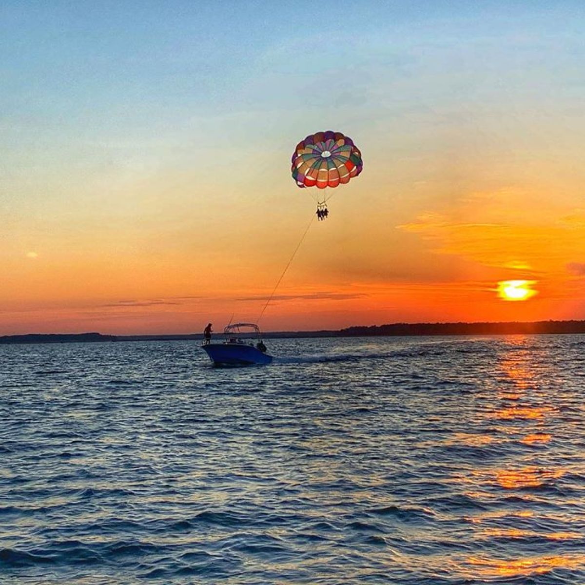 a sunset over a body of water